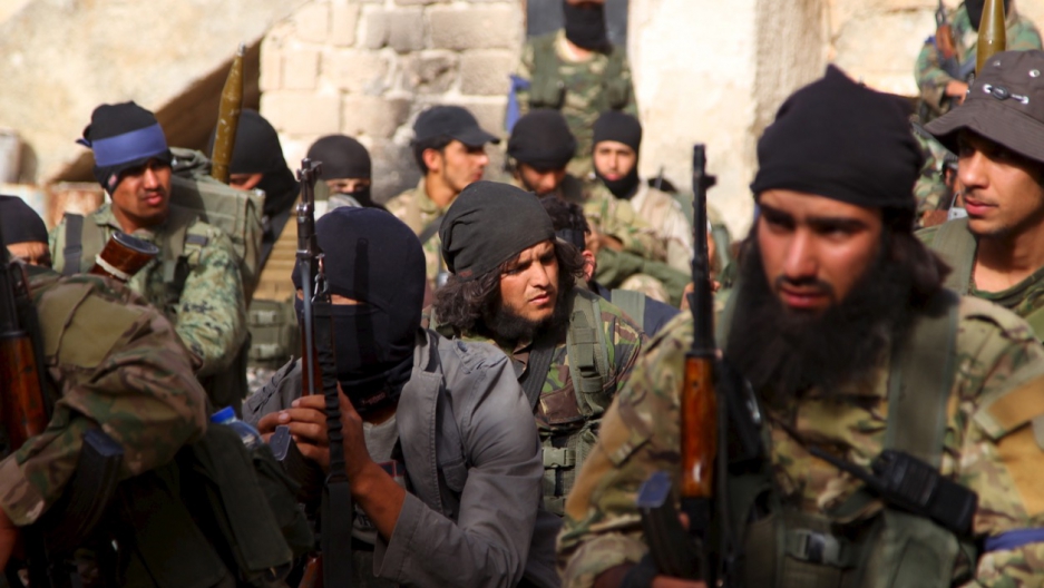 Members of al-Qaeda's Nusra Front gather before moving toward their positions during an offensive to take control of the northwestern Syrian city of Ariha, Idlib province, from forces loyal to President Bashar al-Assad, on May 28, 2015. Members of al-Qaeda's Nusra Front gather before moving toward their positions during an offensive to take control of the northwestern Syrian city of Ariha, Idlib province, from forces loyal to President Bashar al-Assad, on May 28, 2015.